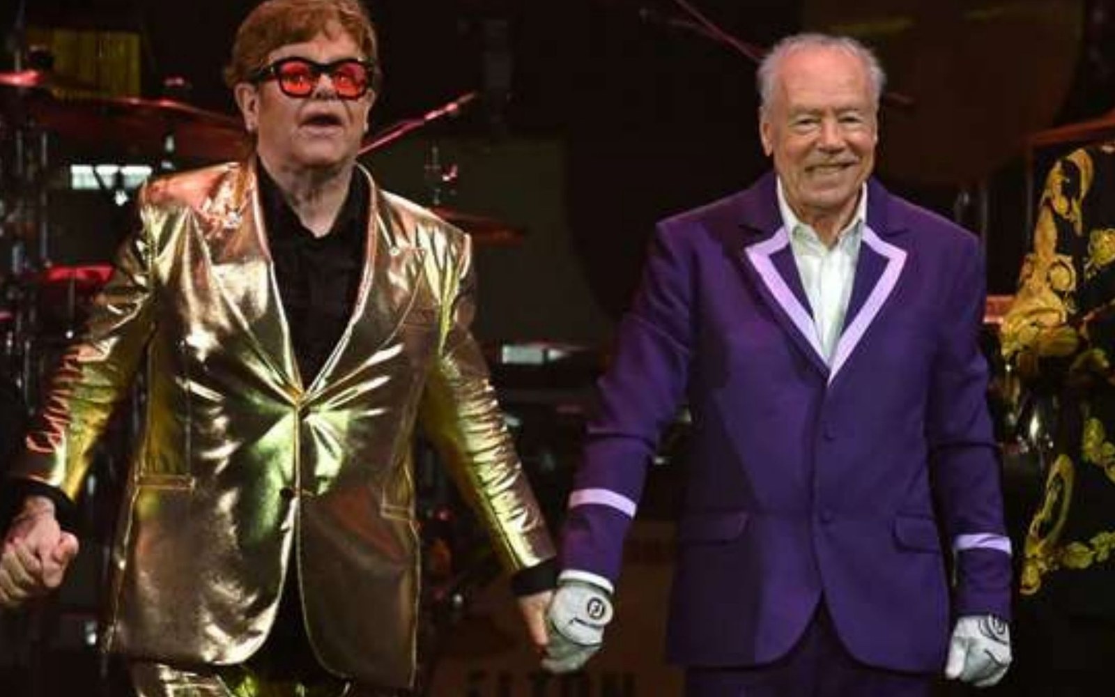Elton John and Nigel Olsson on stage.